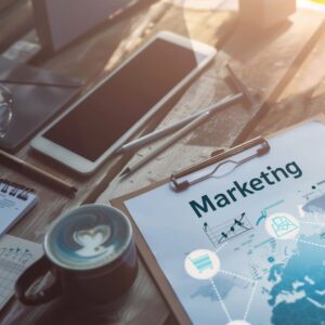 Marketing Strategy Marketing Strategy document on a desk next to a coffee cup